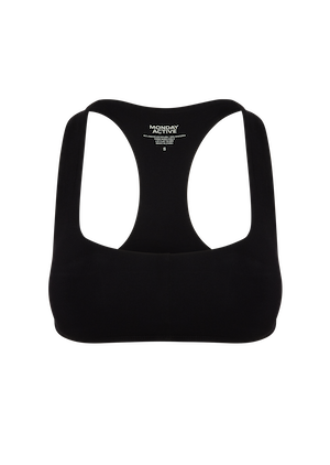 Back view of black racerback sports bra with visible label reading KOH ACTIVE S.
